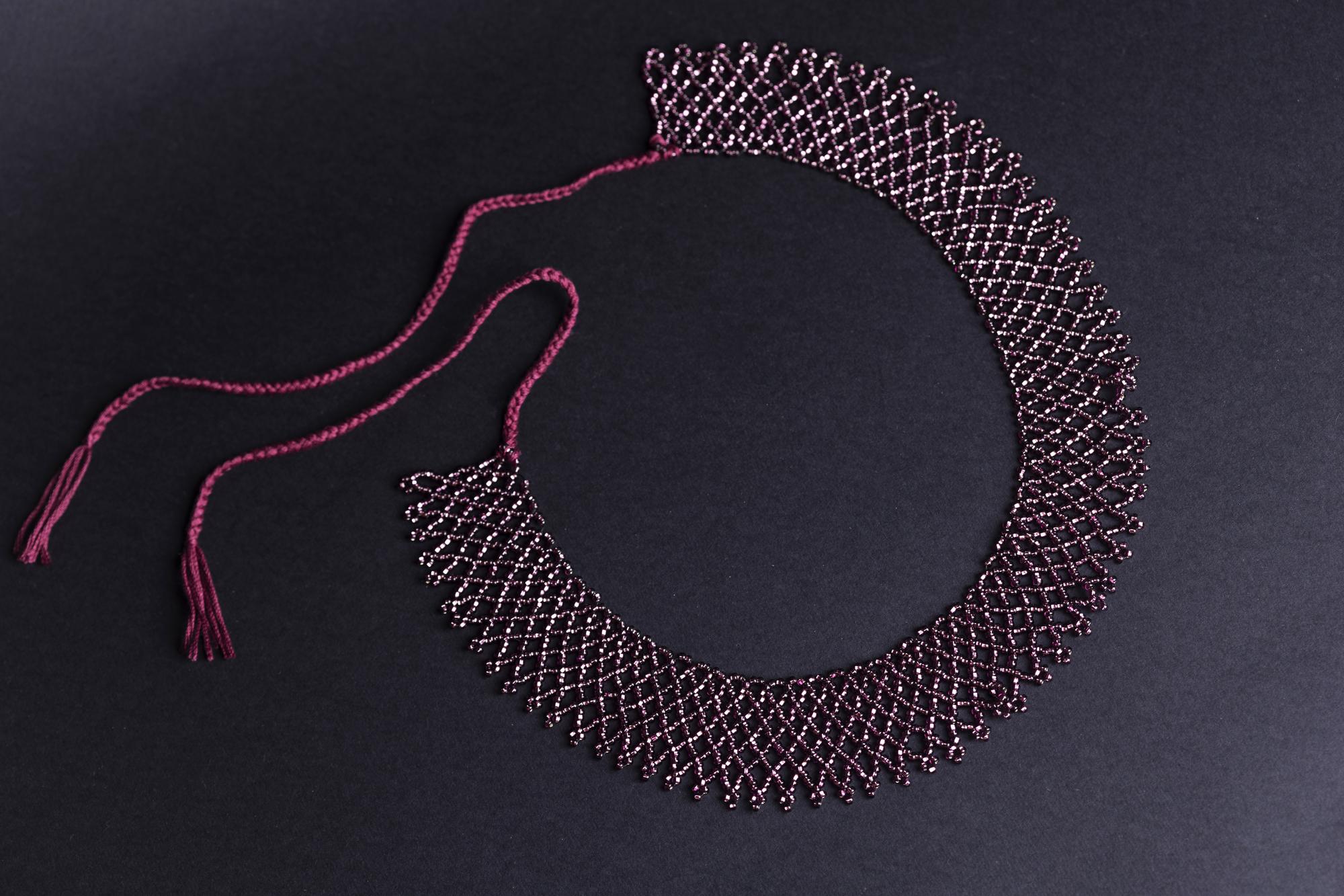 Finished collar with tonal embroidery and hand anchoring