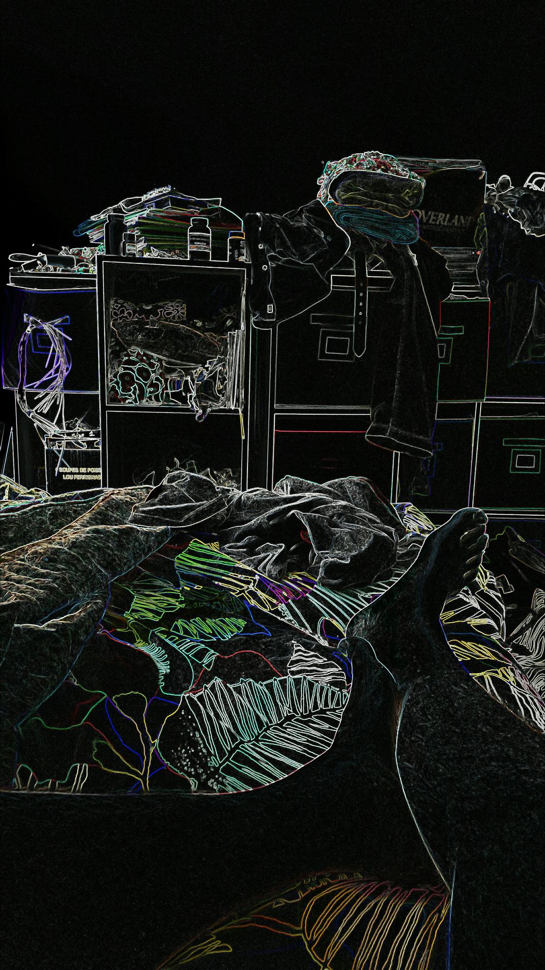 Studio workspace with threads and plotted stitch maps